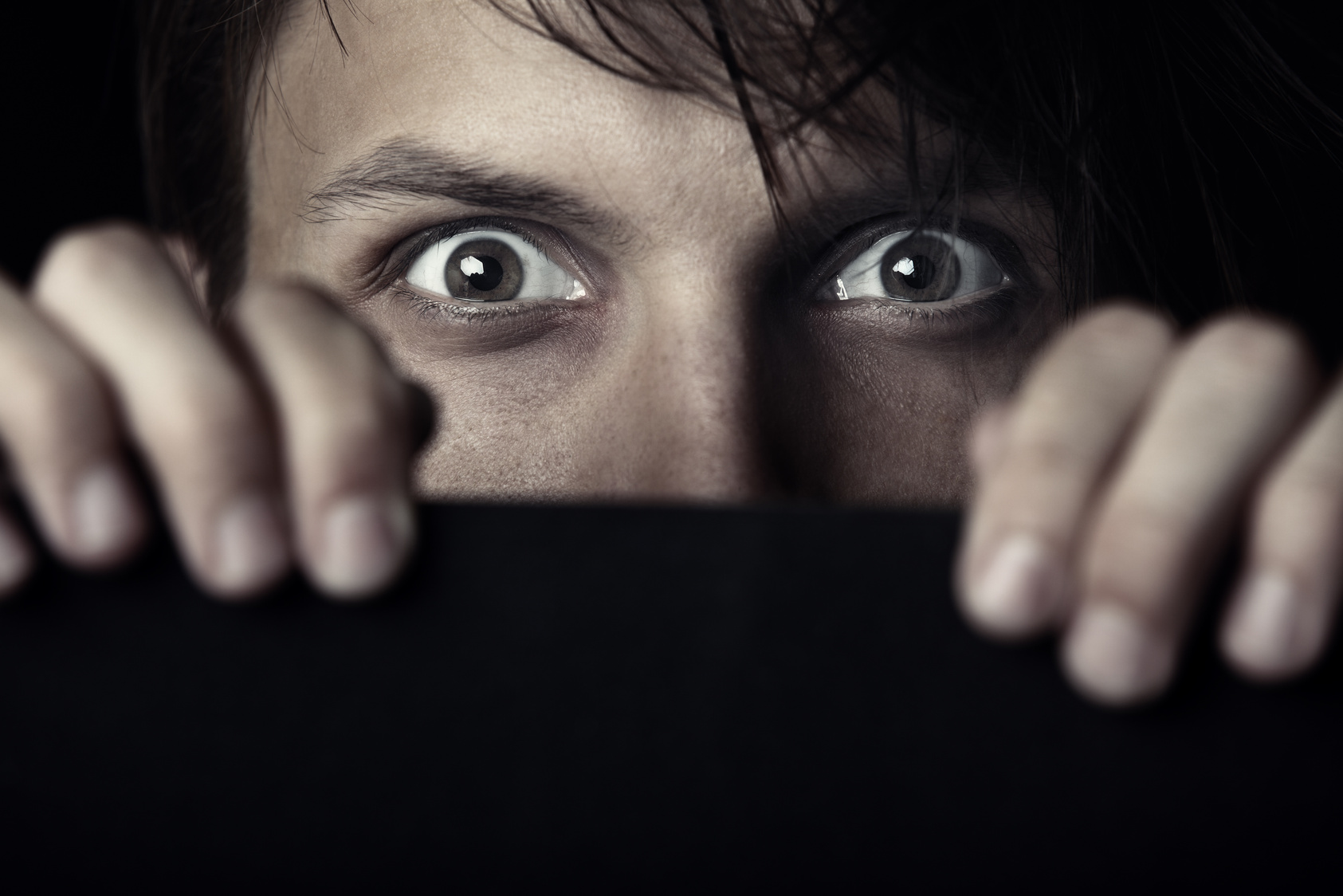 Man Peeking from Wall