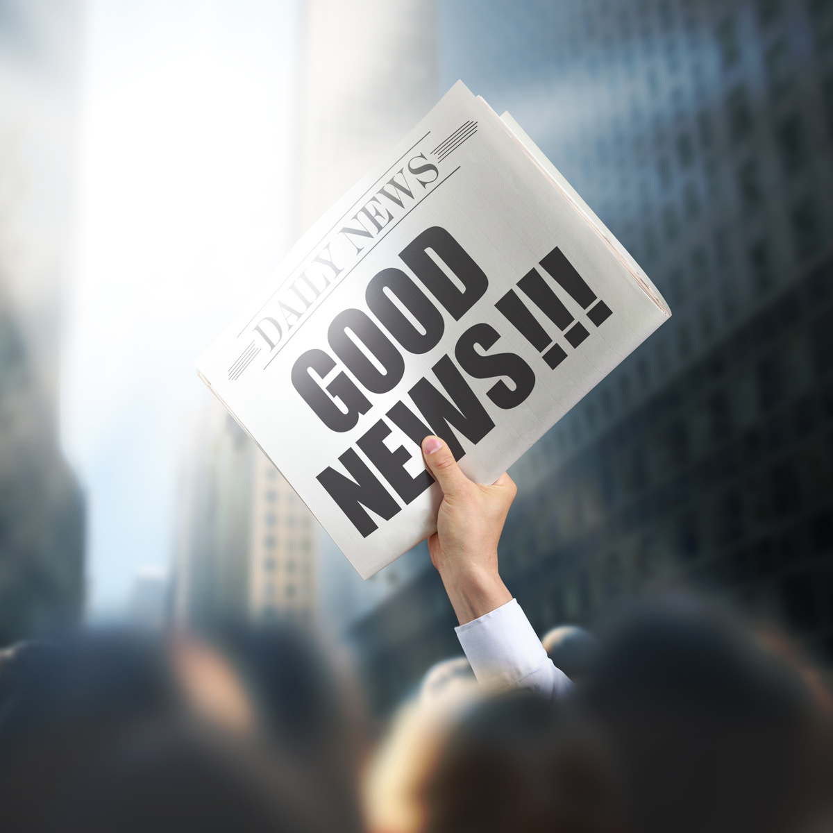 Holding Newspaper with Good News